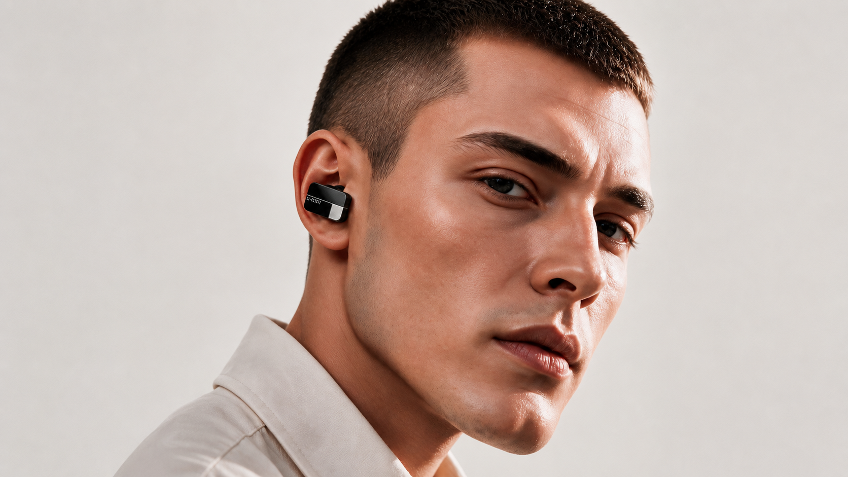 An Ear Computer, an AI-native computing device worn at the ear